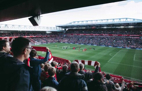 Fans raising the banner high after Liverpool wins 2-0 against Totten ham FC